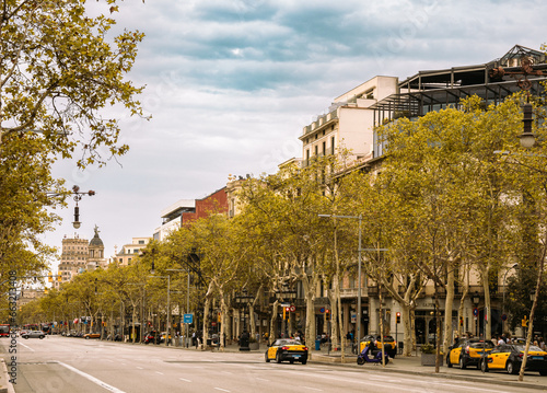 Barcelona, Spain - September 03, 2023: Passeig de Gracia in autumn in Barcelona. Spain. It one of major avenue in city. Located in Eixample district photo