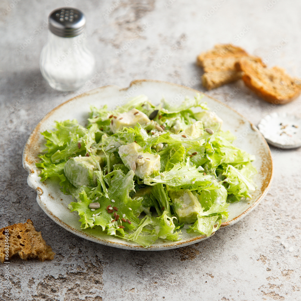 Healthy leaf salad with avocado and seeds Healthy leaf salad with avocado and seeds