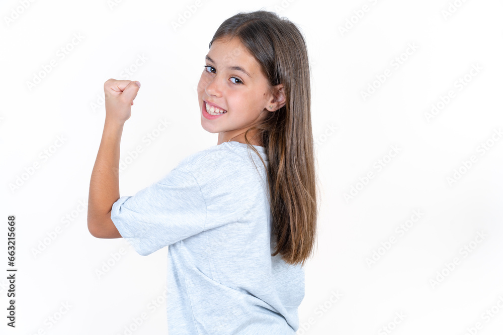 Profile side view portrait Beautiful little kid girl wearing blue T-shirt celebrates victory Profile side view portrait Beautiful little kid girl wearing blue T-shirt celebrates victory