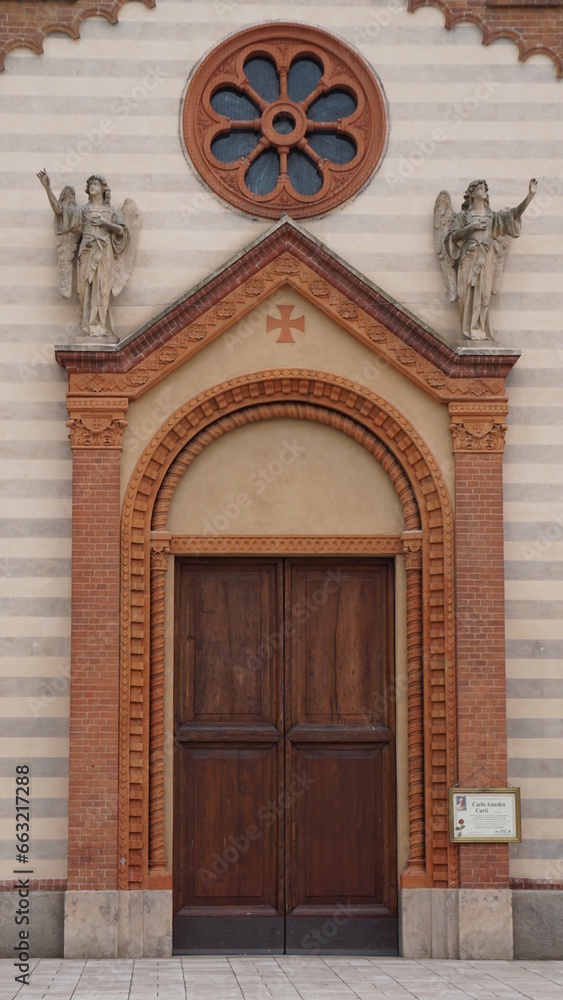 The entrance of the catholic church Parrocchia Santi Nazzaro e Celso in Sannazzaro de Burgondi, Italy, in the month of May