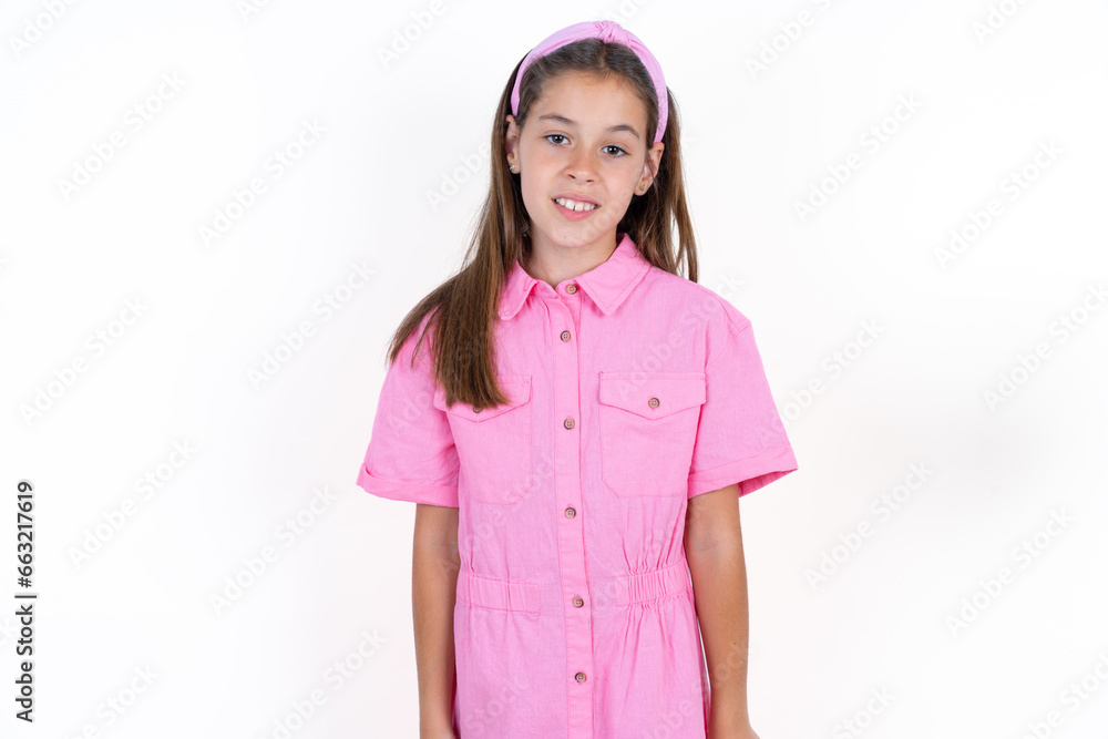 Beautiful little kid girl wearing pink dress with a happy and cool smile on face. Lucky person. Beautiful little kid girl wearing pink dress with a happy and cool smile on face. Lucky person.
