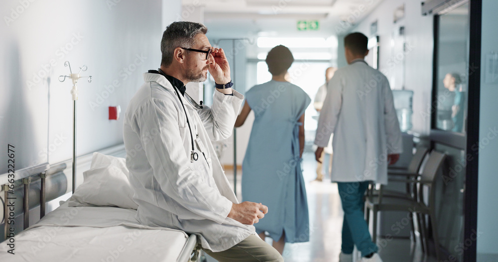 Depression, grief or fail with a mature doctor in a hospital looking unhappy for healthcare or medical. Stress, mistake or loss with a sad man medicine professional in a professional medicare clinic Depression, grief or fail with a mature doctor in a hospital looking unhappy for healthcare or medical. Stress, mistake or loss with a sad man medicine professional in a professional medicare clinic