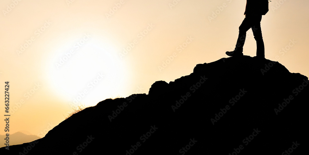 silhouette of a man on top of a mountain peak generative ai 