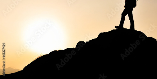 silhouette of a man on top of a mountain peak generative ai 