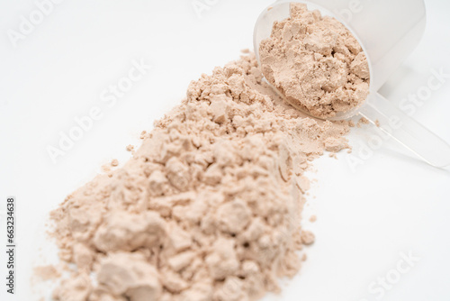 scoop of protein powder isolated on white 