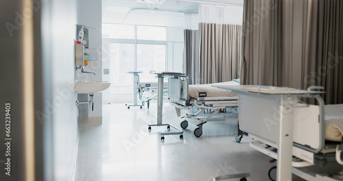 Hospital, modern and interior of bedroom or empty room for healthcare, consulting or healing. Background, medical and clinic space for emergency, rehabilitation or recovery with furniture or light