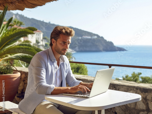 Young man working remotely on a terrace with a view. AI generative. © Macarena