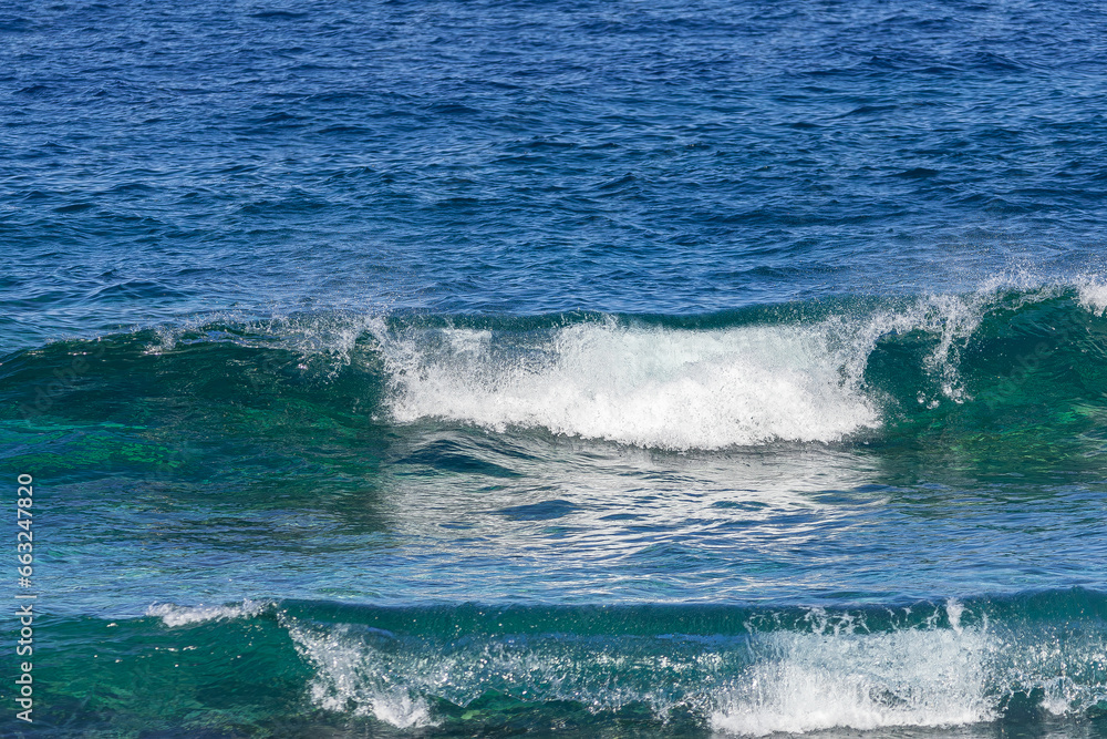 wave forming a tube, with the afternoon light, in the Atlantic Ocean wave forming a tube, with the afternoon light, in the Atlantic Ocean