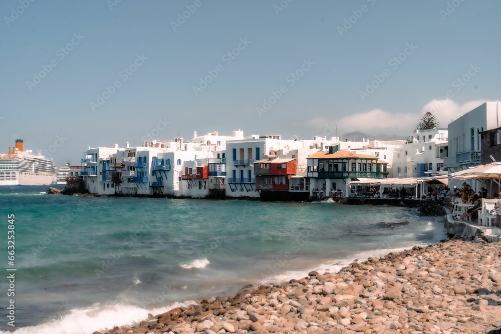 Aerial view of the beautiful cityscape of Mykonos, Greece with stunning shoreline buildings