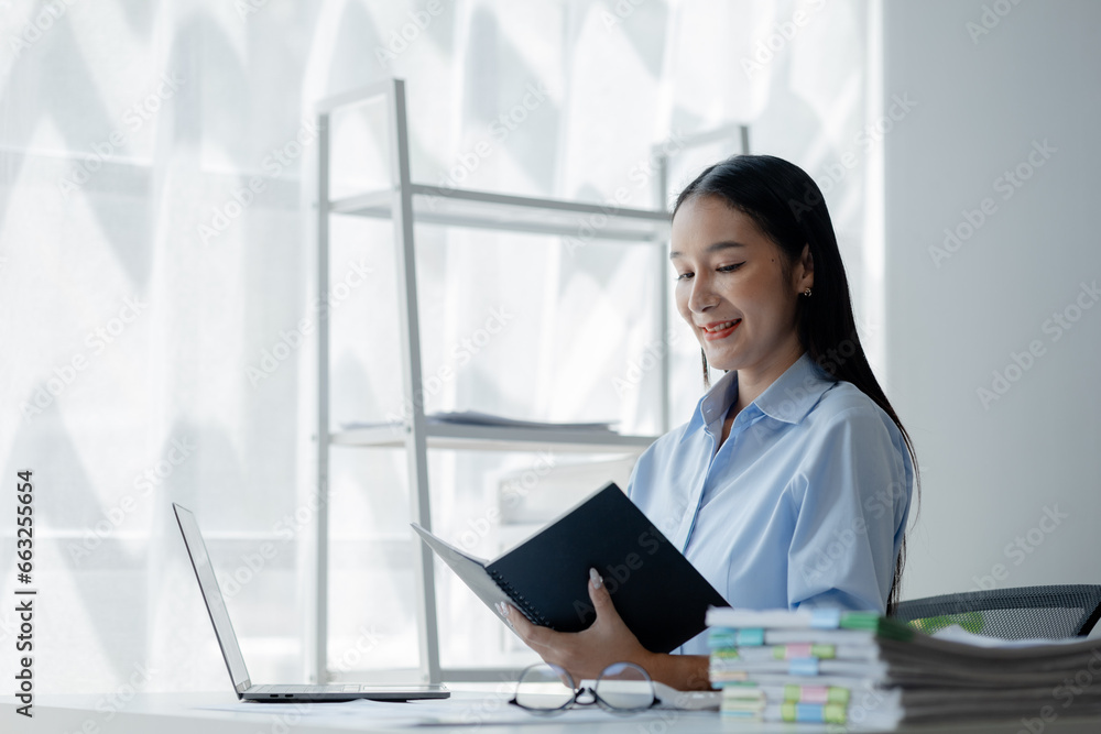 Asian woman sitting in startup company office, businesswoman, executive and investor in business and stocks, management of young people, new concept. Start-up company management concepts. Asian woman sitting in startup company office, businesswoman, executive and investor in business and stocks, management of young people, new concept. Start-up company management concepts.