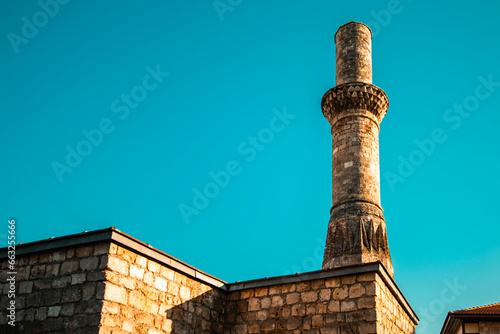 Kesik Minaret (Korkut Mosque), located among the historical structures and fascinating natural beauties of Antalya's Kaleici. Antalya, Turkey.