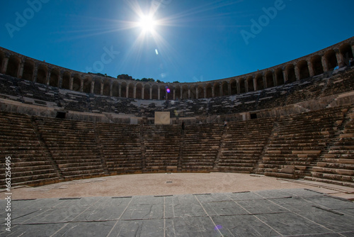 Magnificent view with sunlight hitting the Aspendos Roman amphitheater. Belkiz - Antalya, Turkey. photo