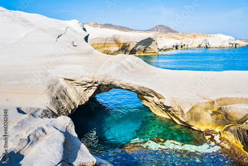 Famous cave at rocky beach of Sarakiniko with crystal clear sea water bay, Milos island, Cyclades, Greece