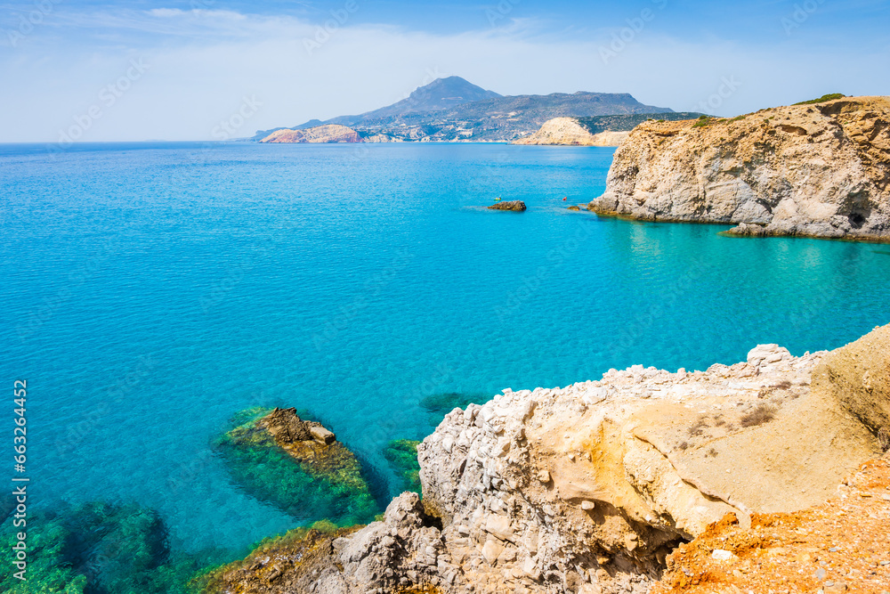 Obraz premium View of beautiful rocky coast near Tsigrado beach and azure sea water, Milos island, Cyclades, Greece