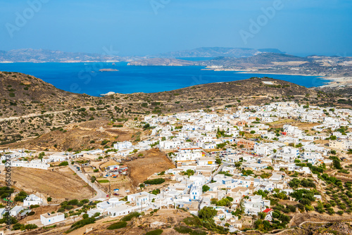View of Plaka village with white houses and sea view from high vantage point, Milos island, Cyclades, Greece © pkazmierczak