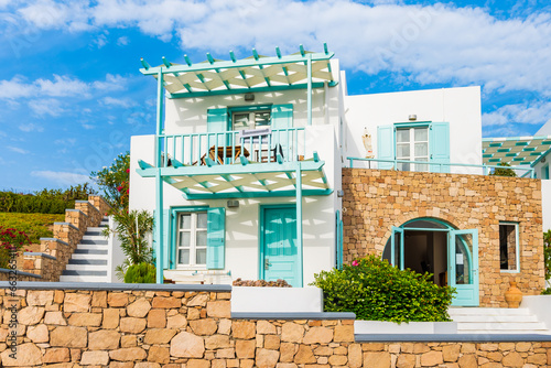 Traditional white style apartment building near Pollonia village, Milos island, Cyclades, Greece photo