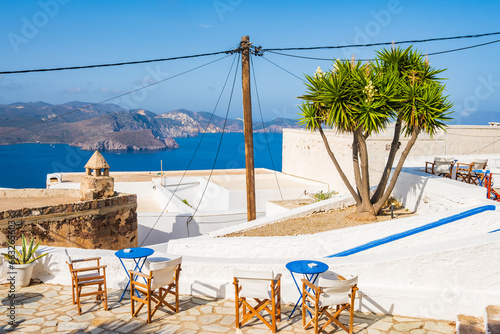 Cuadro en lienzo Chairs with tables on terrace with typical Greek architecture in Plaka village,