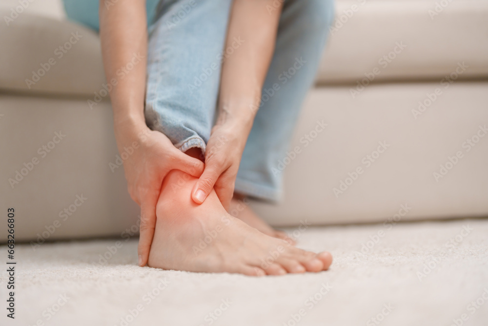 woman having leg pain due to Ankle Sprains or Achilles Tendonitis and