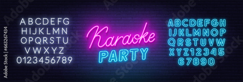 Karaoke party neon lettering  on brick wall background.