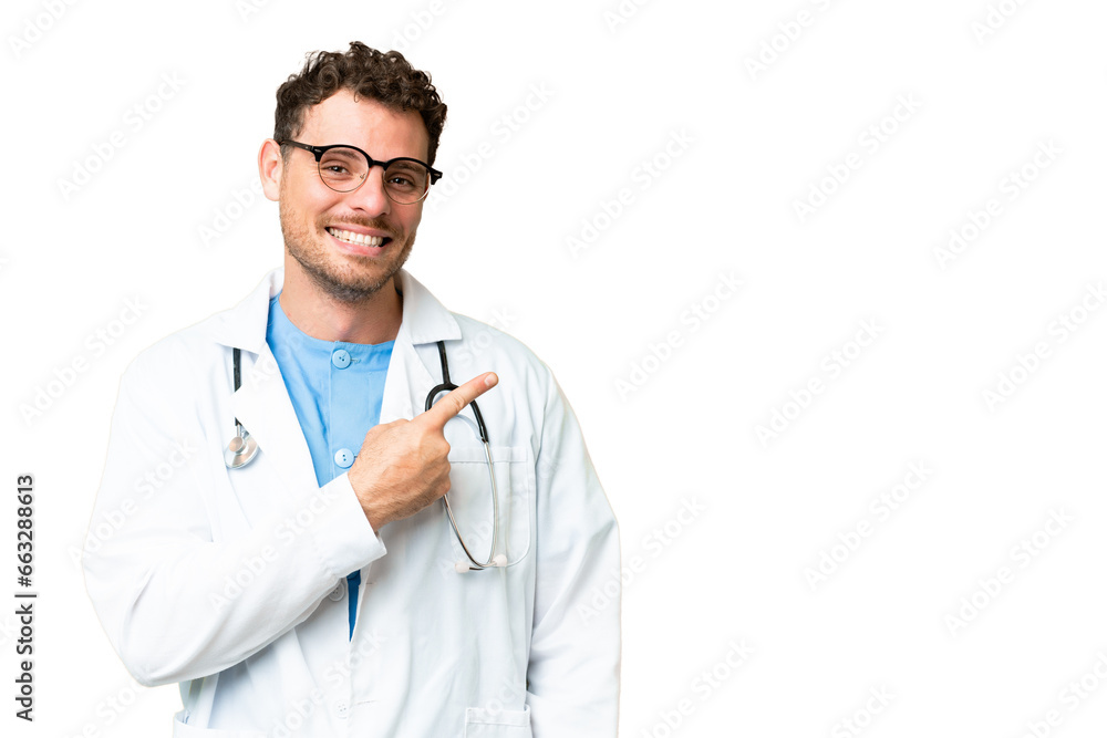 Brazilian doctor man over isolated chroma key background pointing to the side to present a product
