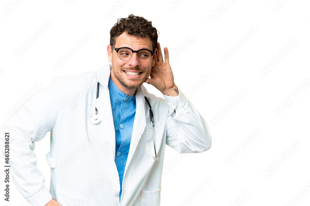 Brazilian doctor man over isolated chroma key background listening to something by putting hand on the ear Brazilian doctor man over isolated chroma key background listening to something by putting hand on the ear