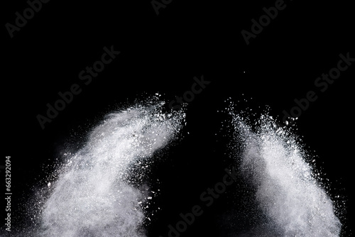 Fototapeta Naklejka Na Ścianę i Meble -  White powder explosion on black background. Colored cloud. Color dust explode. Paint Holi