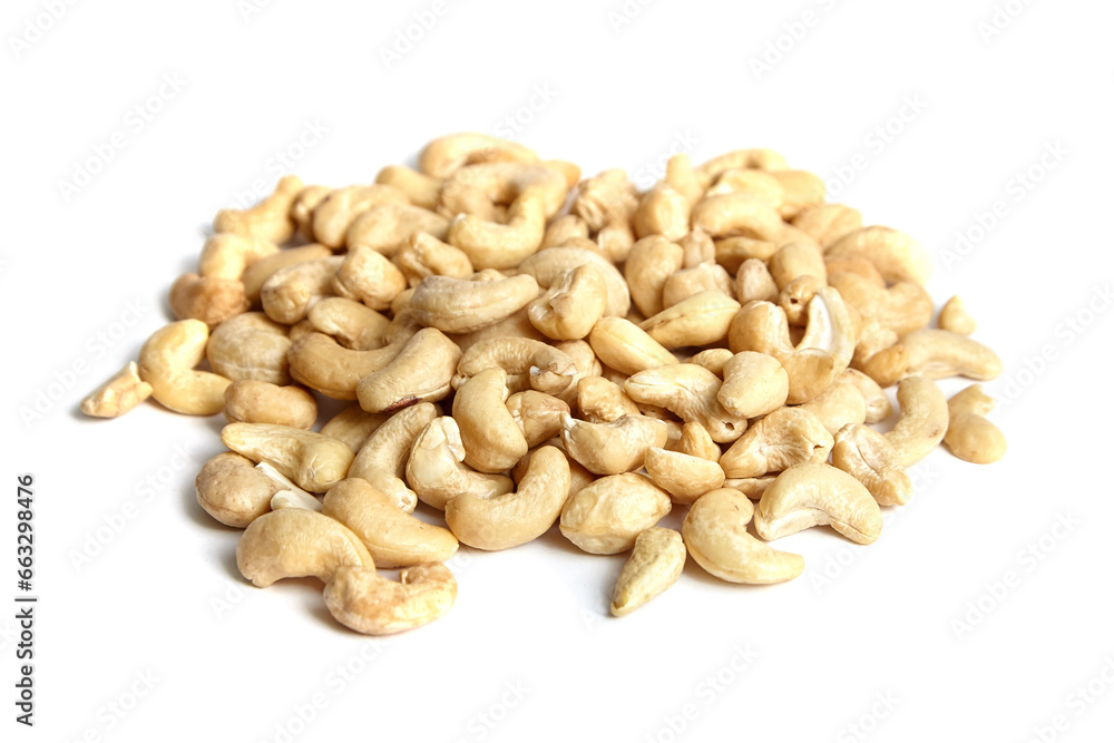 Cashew nut heap isolated on white background. Closeup of peeled cashews Cashew nut heap isolated on white background. Closeup of peeled cashews