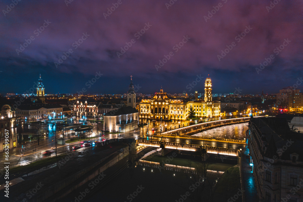 Oradea romania tourism aerial a city skyline at night with a beautiful bridge and historic buildings