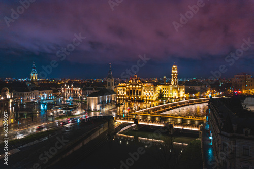 Oradea romania tourism aerial a city skyline at night with a beautiful bridge and historic buildings