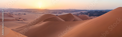 Aerial View of sand dunes at sunset in the Sahara desert, Djanet, Algeria, Africa. photo