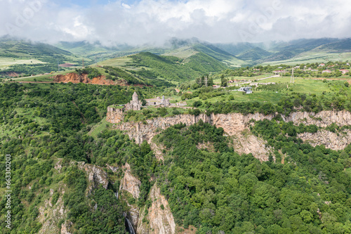 Aerial view of Tatev Monastery on the rocks, a monastery complex with view over the valley and mountains, Tatev, Syunik Province, Armenia. photo