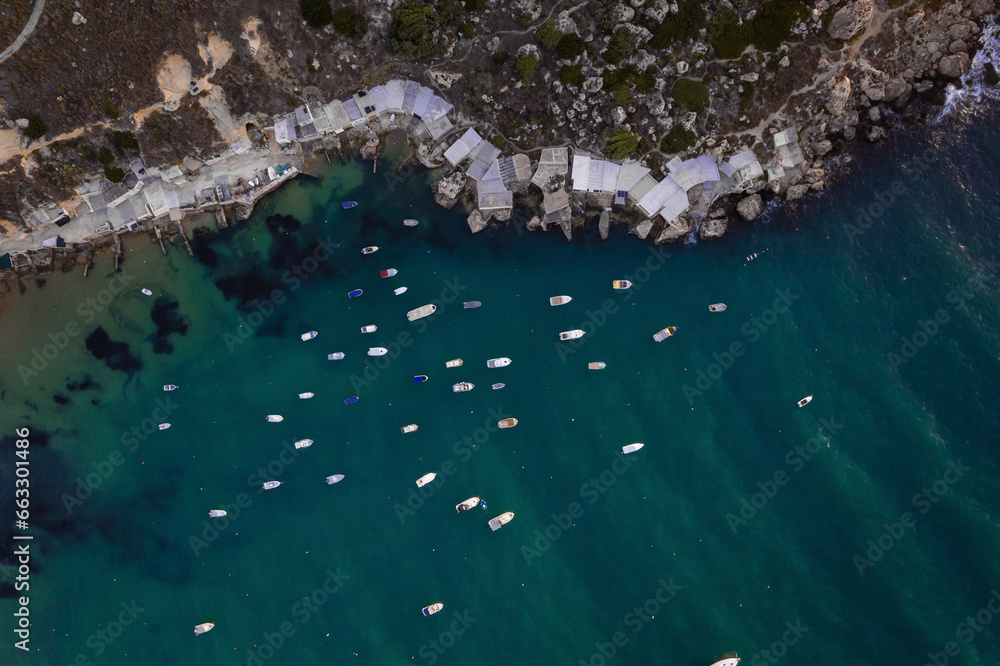 Aerial view of sailboats along Gnejna Bay coastline, Mgarr, Malta. Aerial view of sailboats along Gnejna Bay coastline, Mgarr, Malta.