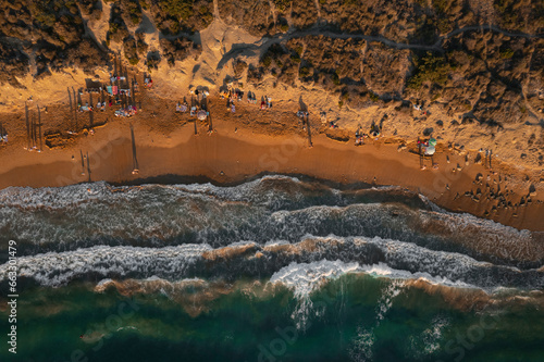 Aerial view of people on Ghajn Beach in Mgarr, Malta. photo
