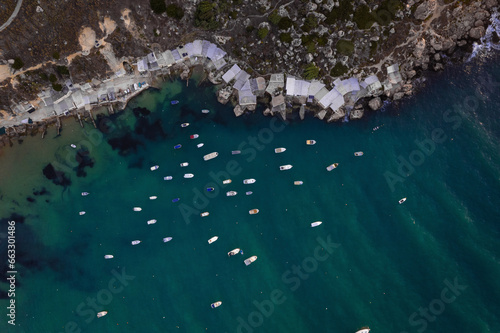 Aerial view of sailboats along Gnejna Bay coastline, Mgarr, Malta. photo