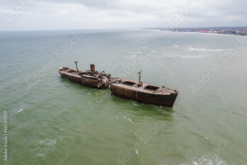 Aerial View of Evangelia Cargo Ship Shipwreck Beached On The Coast, Romania. photo