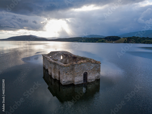 Aerial View of Abandoned Sunken Church of Jrebchevo Dam, Bulgaria. photo