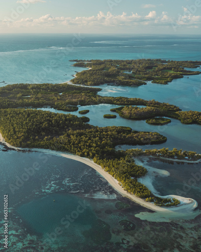 Aerial view of Ilot Mangenie island archipelagos along the coastline at sunset, Ilot Lievres, Flacq, Mauritius. photo