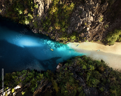 Aerial view of a yellow canoe in Big Lagoon, El Nido, Palawan, Philippines. photo