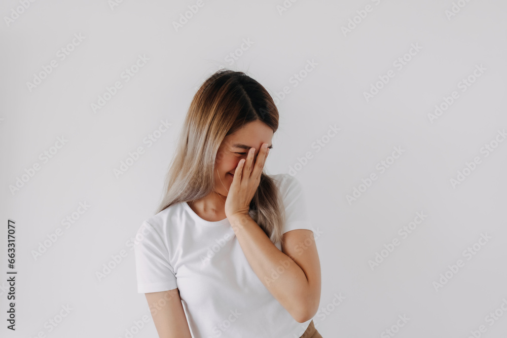 Happy asian Thai woman laughing giggle, funny covering and hiding her face with hand, got secret, shy and embarrassing, isolated on white background. Happy asian Thai woman laughing giggle, funny covering and hiding her face with hand, got secret, shy and embarrassing, isolated on white background.