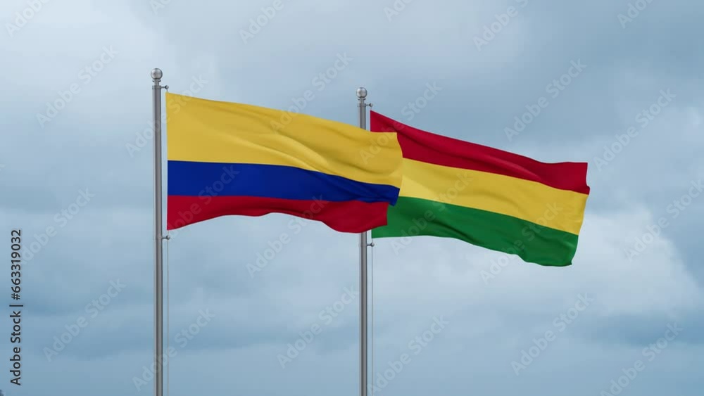Bolivia flag and Colombia flag waving together on cloudy sky, endless seamless loop, two country relations concept Bolivia flag and Colombia flag waving together on cloudy sky, endless seamless loop, two country relations concept