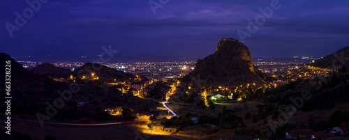 Panoramic night view of Afyonkarahisar city with Karahisar castle. Thermal capital of the Central Anatolia region. The province famous for its sausage and Turkish delight. Inner Aegean region, Turkey 