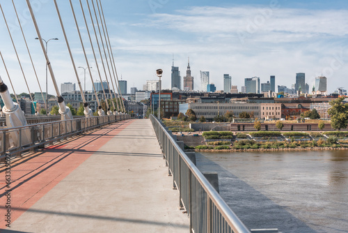 Photos of the Śląsko-Dąbrowski Bridge and the view of the city of Warsaw in Poland. We can see most the mix of the new building and the historical soviet ones.