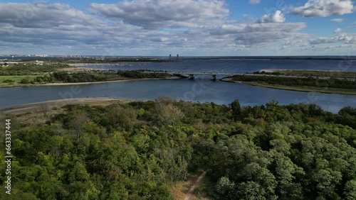 Wallpaper Mural aerial footage of cars driving on a highway bridge overpass above creek (brooklyn queens expressway, BQE) with gil hodges bridge and jamaica bay in the background (nyc, new york city) drone shot Torontodigital.ca