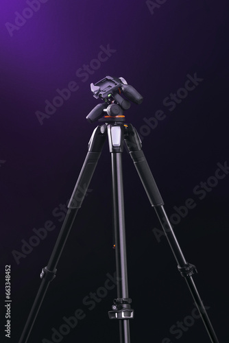 tripod isolated on a dark black background