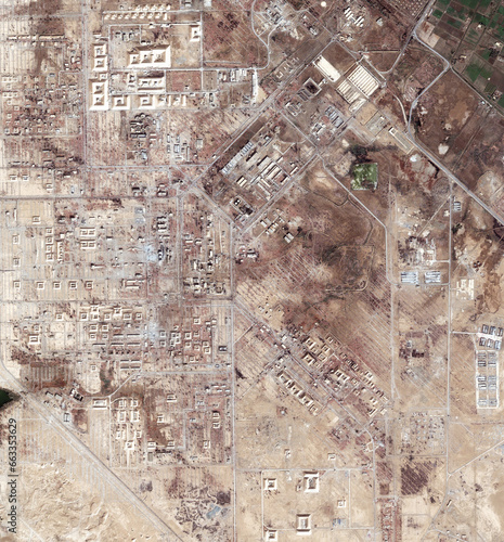 Aerial, drought map and satellite view of landscape, nature and desert outdoor with sand. Land and above with dust, neighborhood and roads with rural development from top with town and terrain