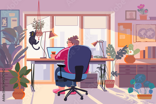 Fat woman working on a laptop while sitting at the table in a cozy interior