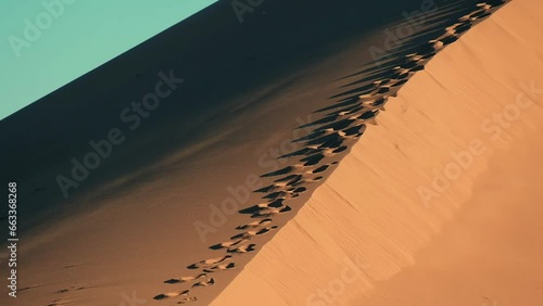 Beautiful sand dune, singing dune in Altyn Emel natural park in autumn, wind and sand in the sun photo