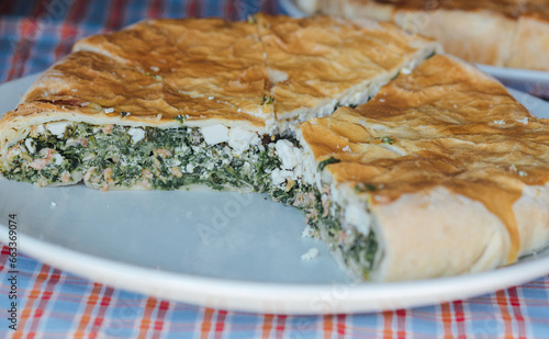 Homemade pie with fillings at the street food fair. Soft focus blurred and noise effect. Delicatessen Homemade food concept photo