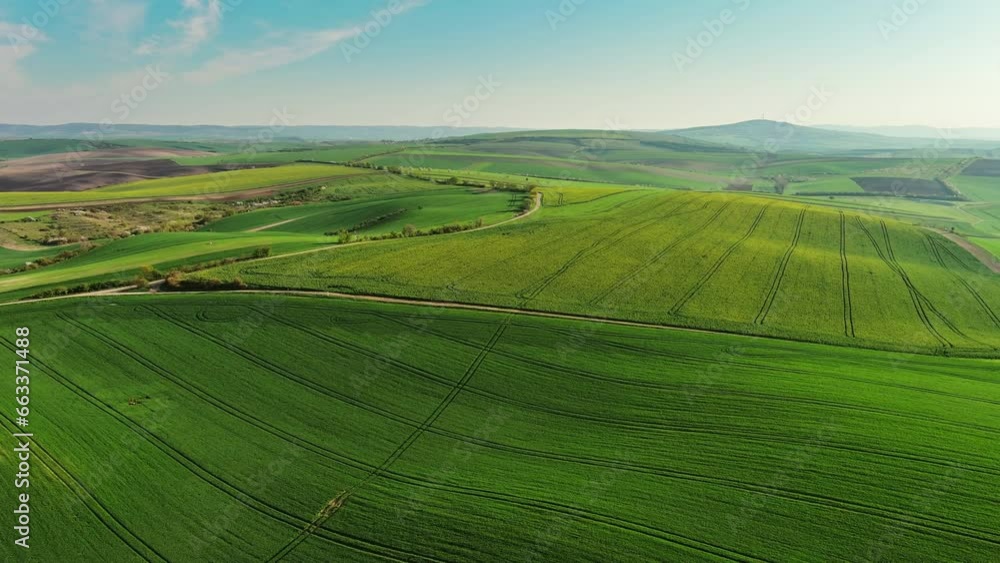Aerial view of amazing green wavy hills with agricultural fields in spring. South Moravia region, Czech Republic, Europe, 4k Aerial view of amazing green wavy hills with agricultural fields in spring. South Moravia region, Czech Republic, Europe, 4k
