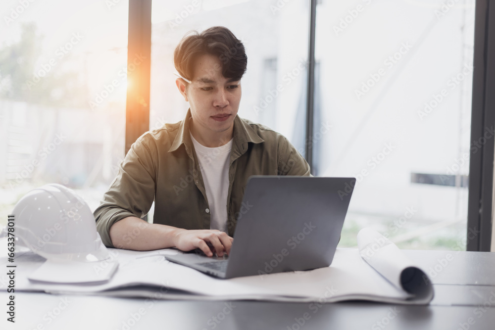Engineer or home designer concept. Engineer working and architectural project and construction at desk in office, Modern Interior designer. Engineer or home designer concept. Engineer working and architectural project and construction at desk in office, Modern Interior designer.